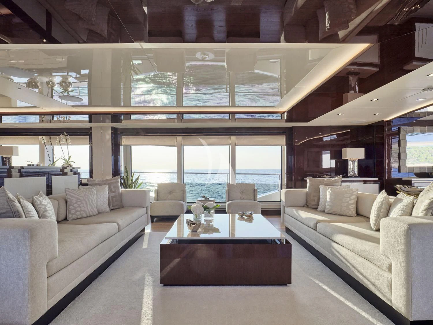 a living room with a large window aboard AQUA LIBRA Yacht for Charter