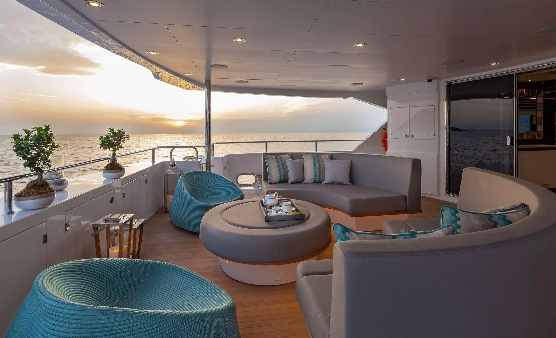 a living room with a couch and a table aboard AQUA LIBRA Yacht for Charter