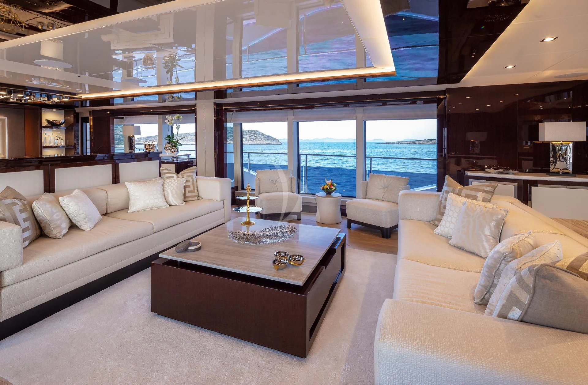 a living room with a large window aboard AQUA LIBRA Yacht for Charter