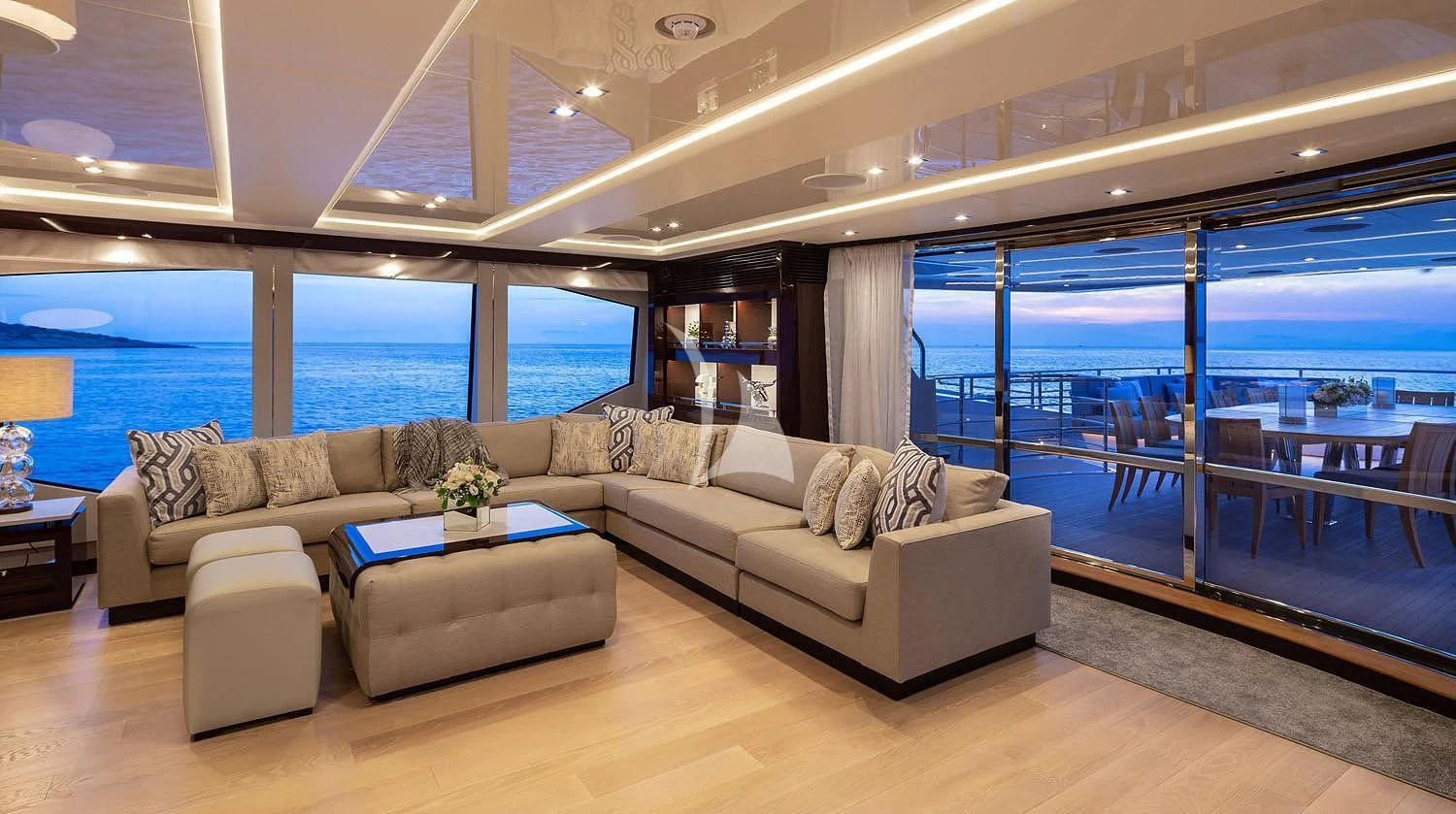 a living room with a large window aboard AQUA LIBRA Yacht for Charter
