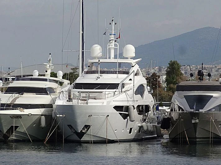a group of boats are parked in the water aboard AQUA LIBRA Yacht for Charter