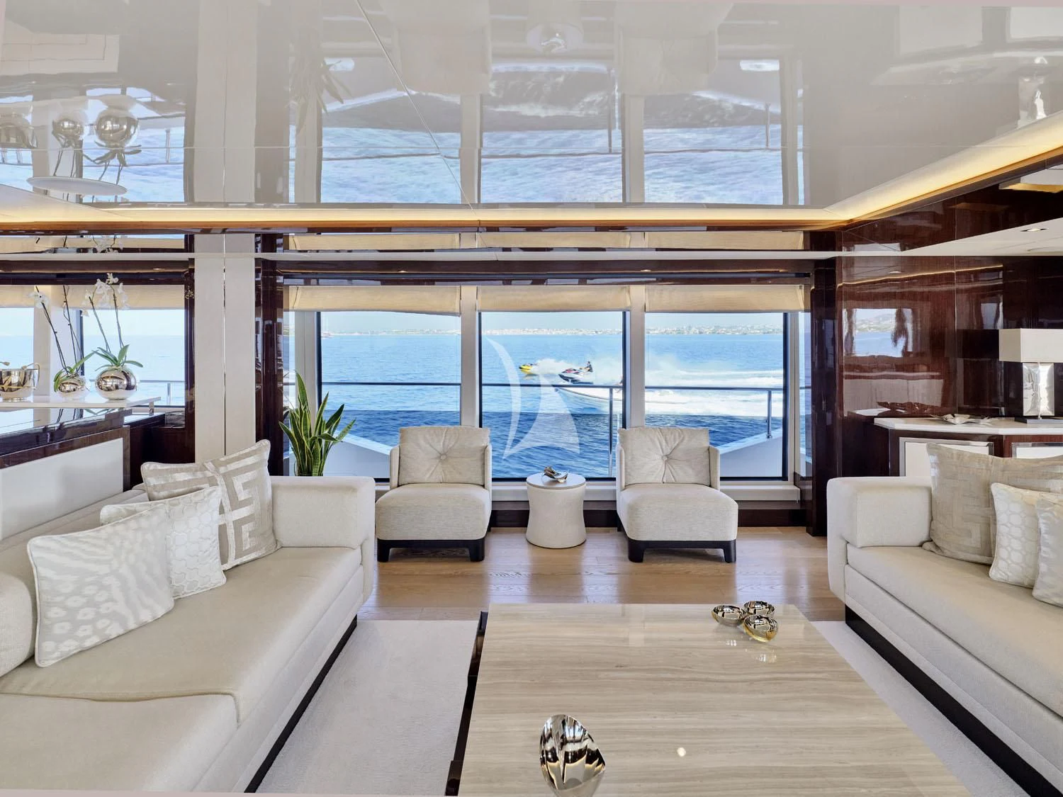 a living room with a large window aboard AQUA LIBRA Yacht for Charter