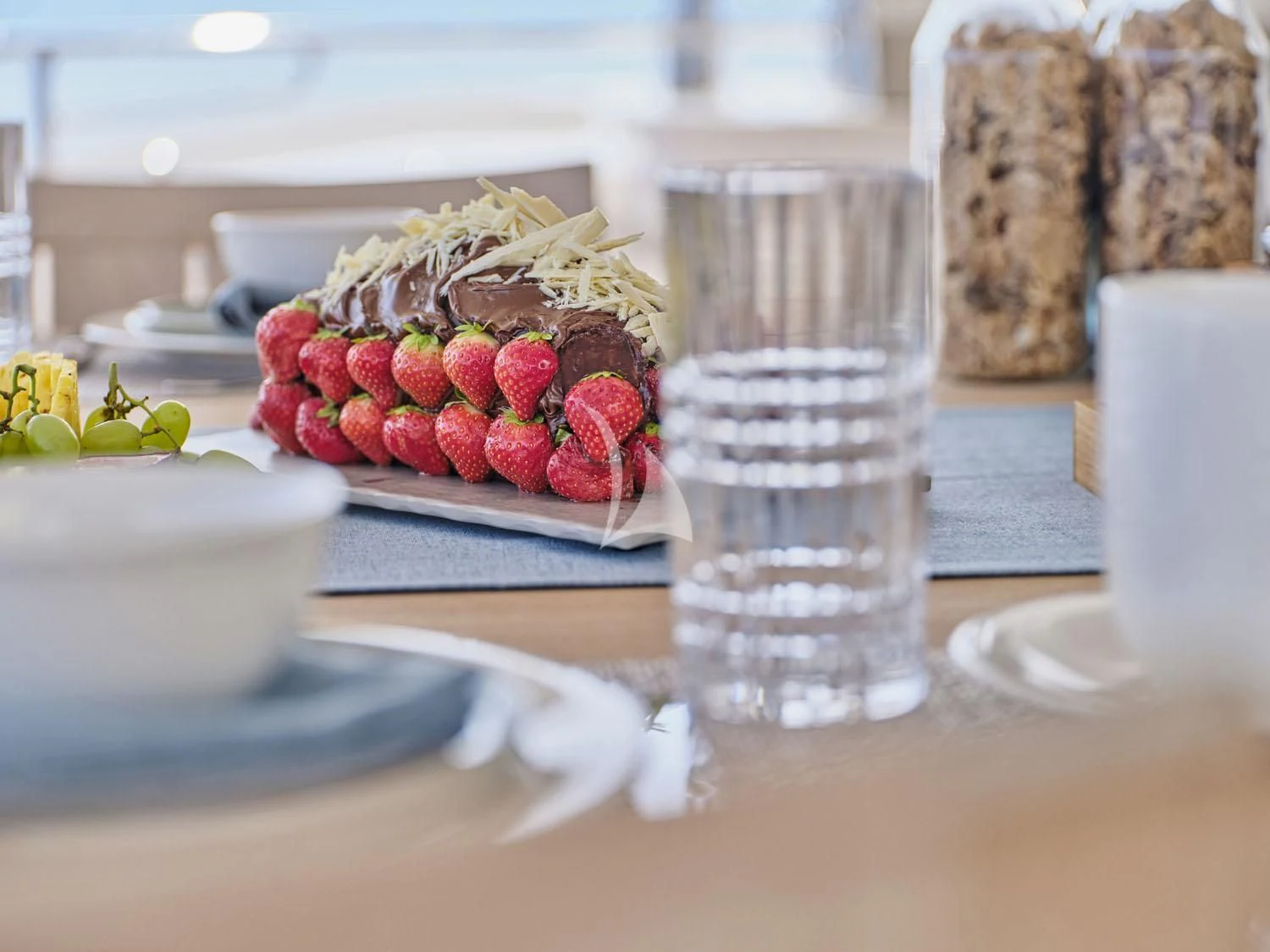a table with food and drinks aboard AQUA LIBRA Yacht for Charter