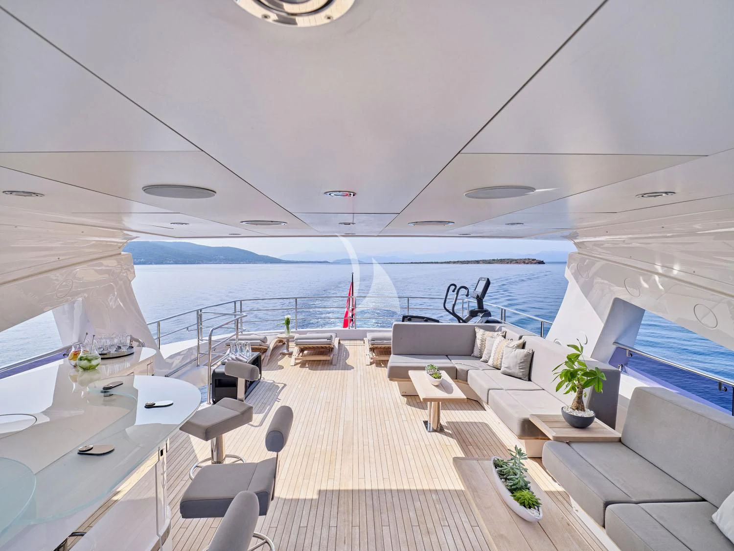 a room with a deck and chairs and a pool aboard AQUA LIBRA Yacht for Charter