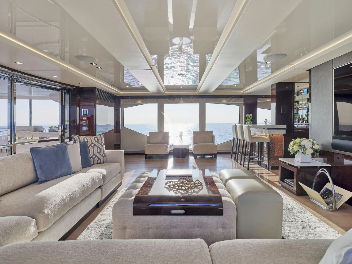 a living room with a large window aboard AQUA LIBRA Yacht for Charter
