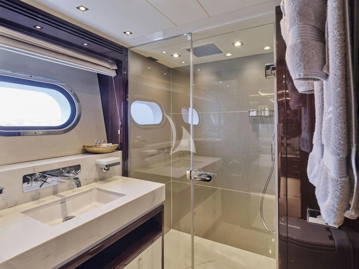 a bathroom with a glass shower aboard AQUA LIBRA Yacht for Charter