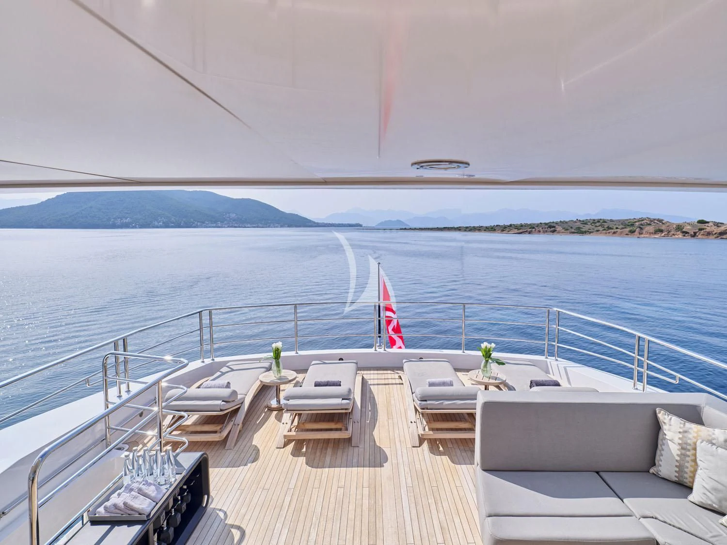 a deck overlooking a body of water aboard AQUA LIBRA Yacht for Charter