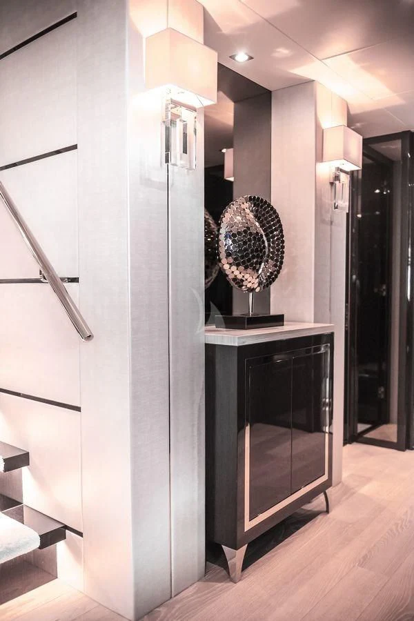 a large silver cabinet in a room aboard AQUA LIBRA Yacht for Charter