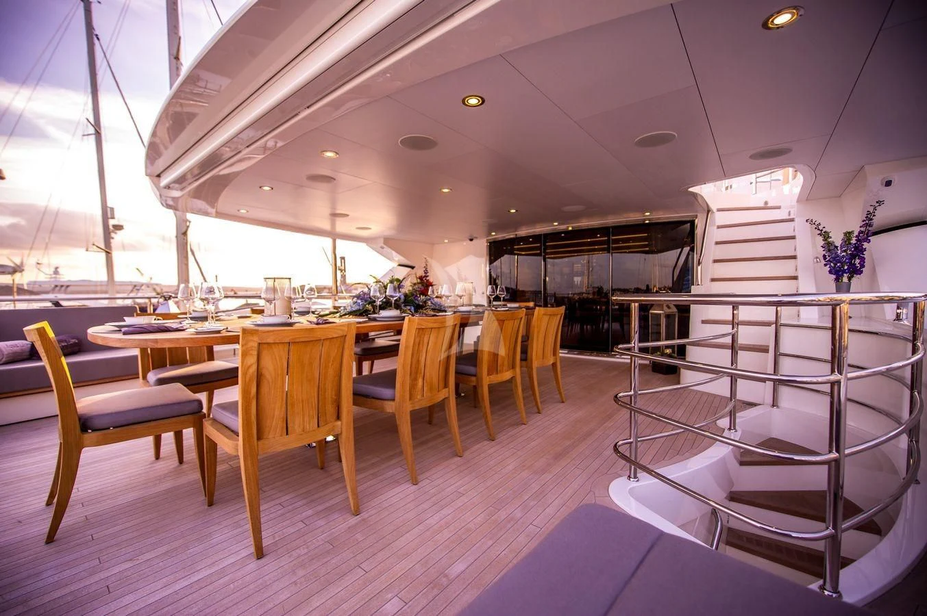 a room with a table chairs and a large window aboard AQUA LIBRA Yacht for Charter