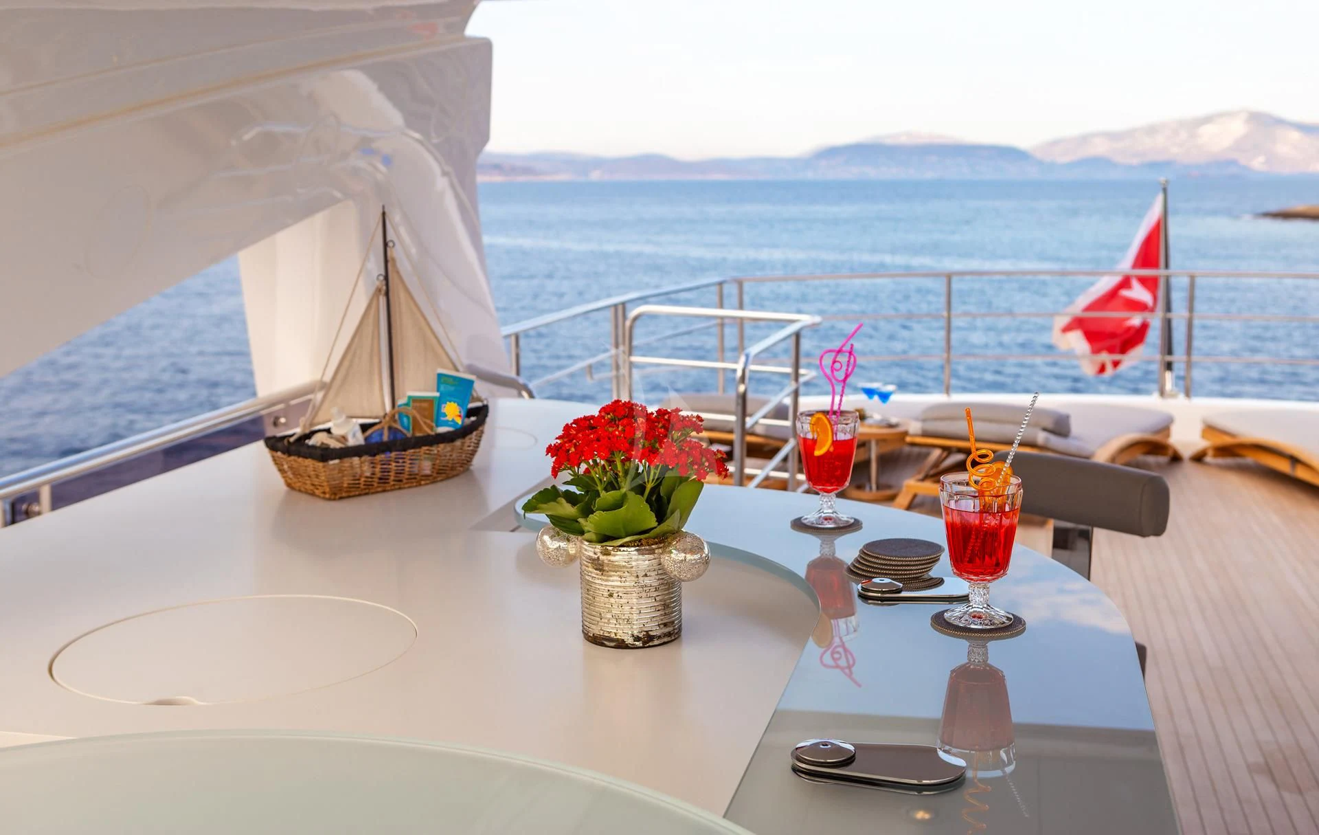 a table with drinks and fruits on it aboard AQUA LIBRA Yacht for Charter