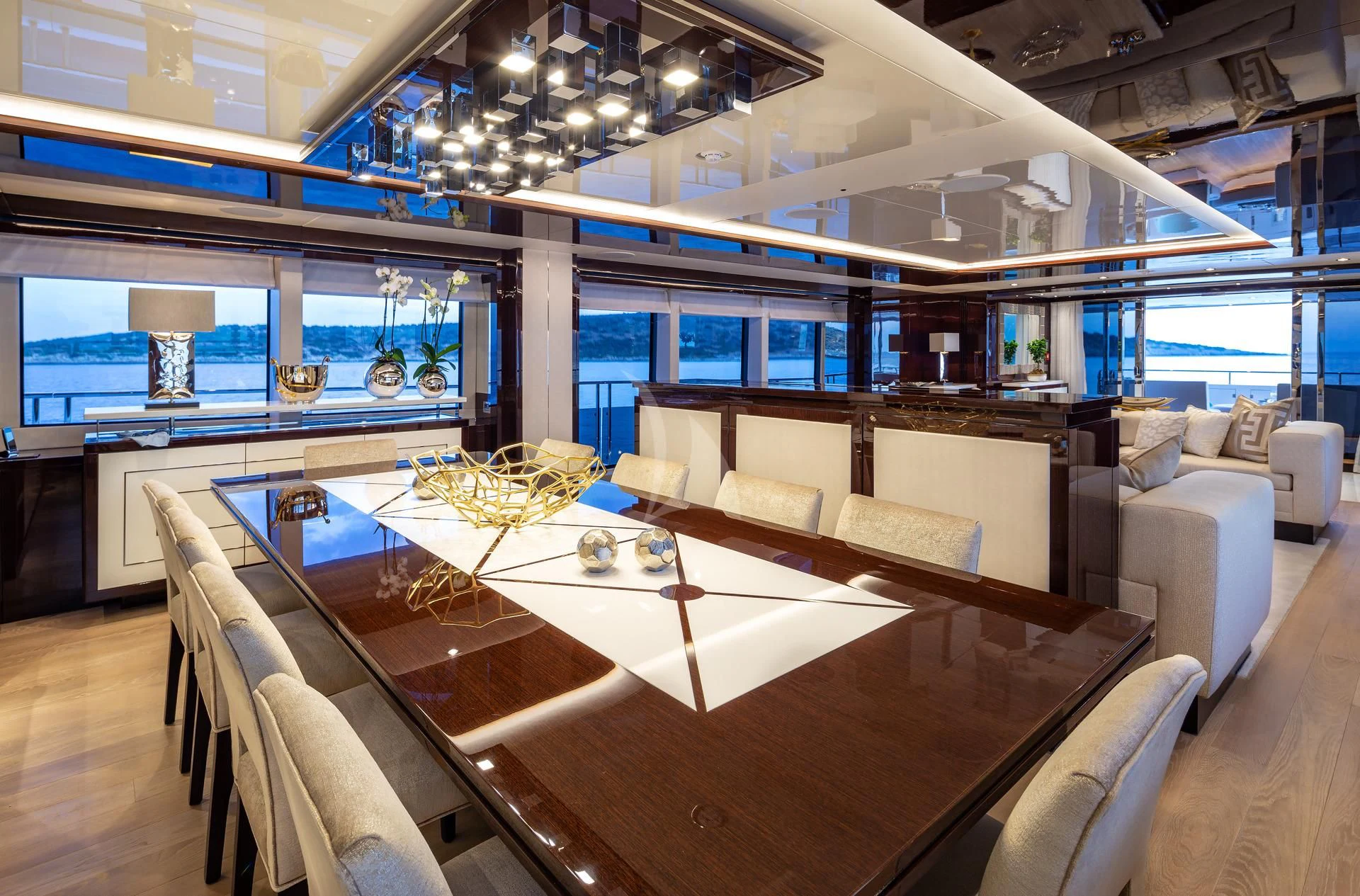 a room with a table and chairs aboard AQUA LIBRA Yacht for Charter