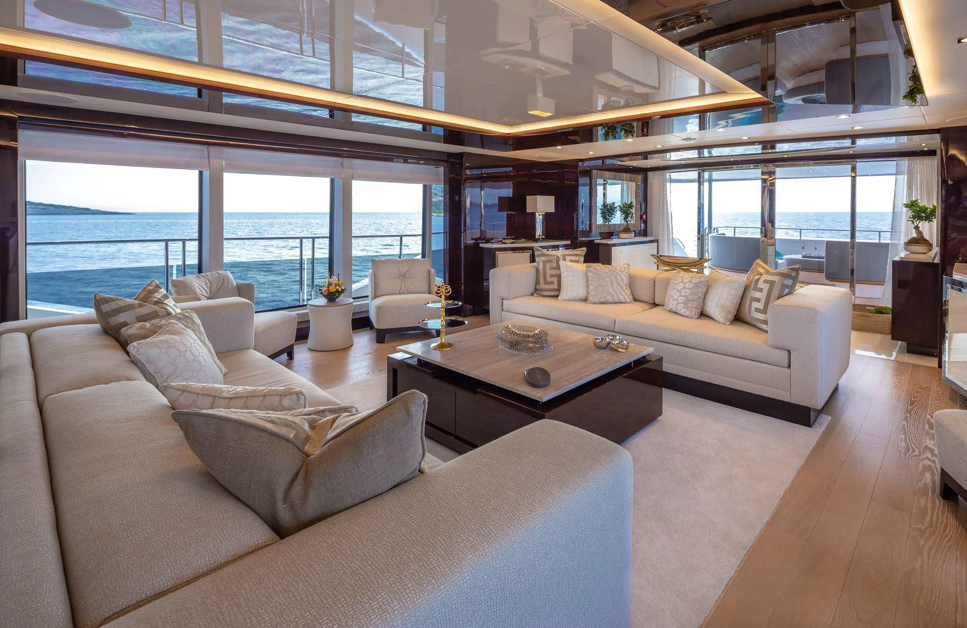 a living room with a large window aboard AQUA LIBRA Yacht for Charter