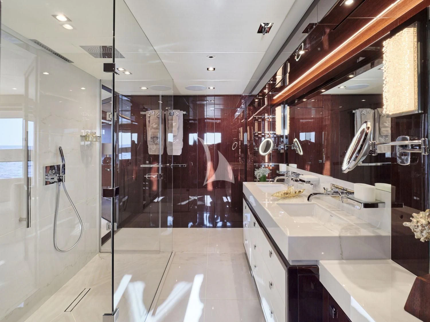 a bathroom with a sink and a mirror aboard AQUA LIBRA Yacht for Charter