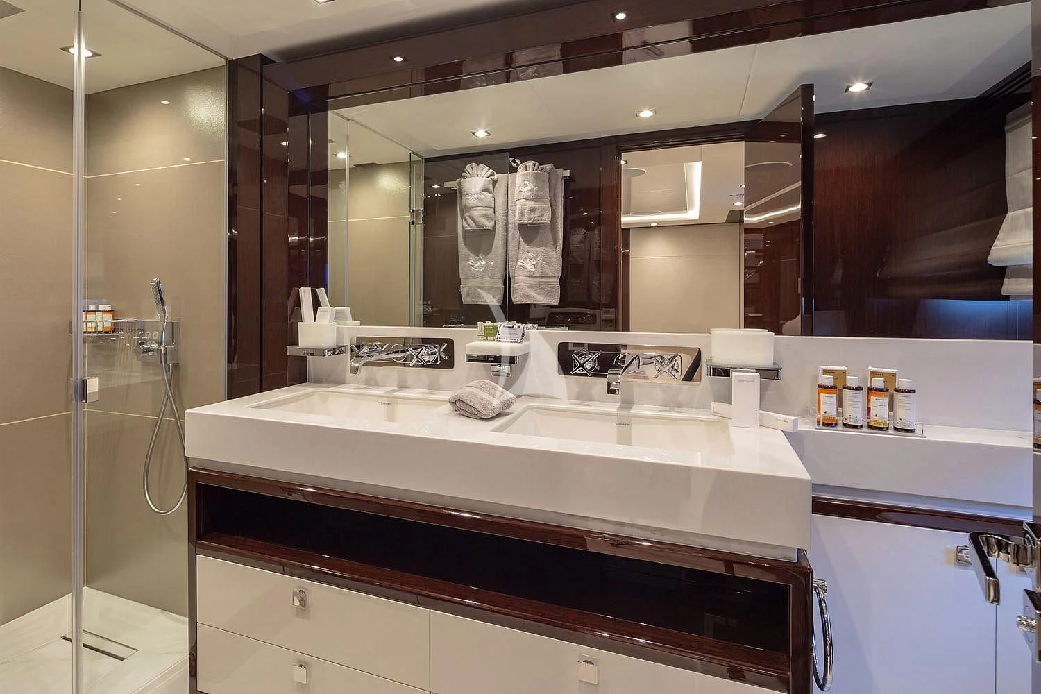 a bathroom with a large mirror aboard AQUA LIBRA Yacht for Charter