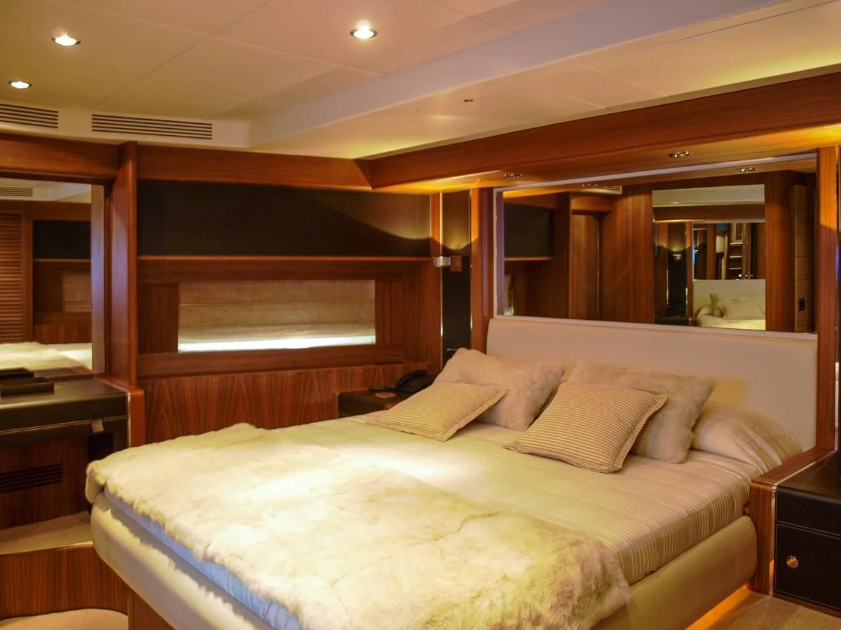 a bed with a white sheet aboard ADEL I Yacht for Sale