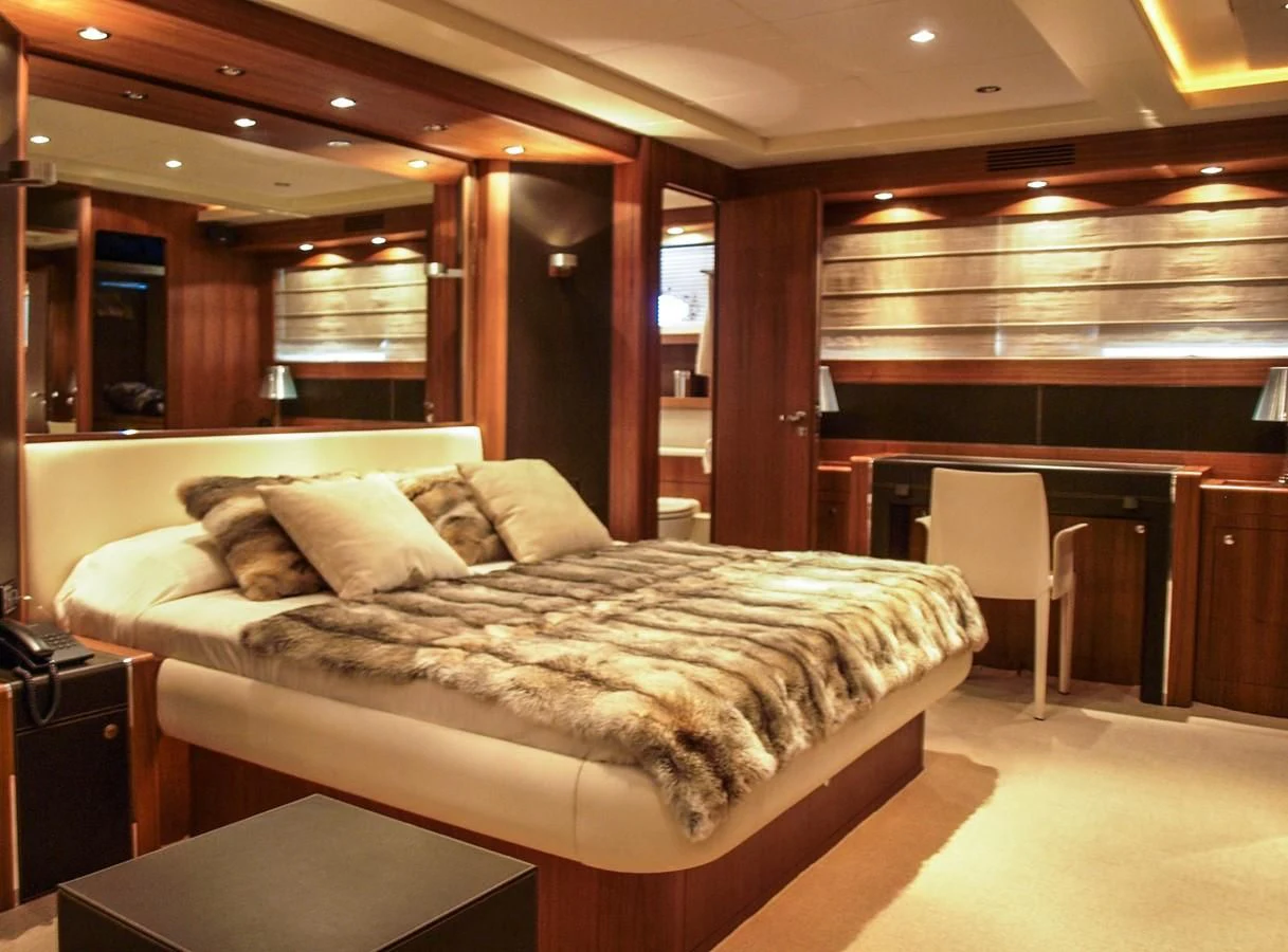 a bed in a room aboard ADEL I Yacht for Sale