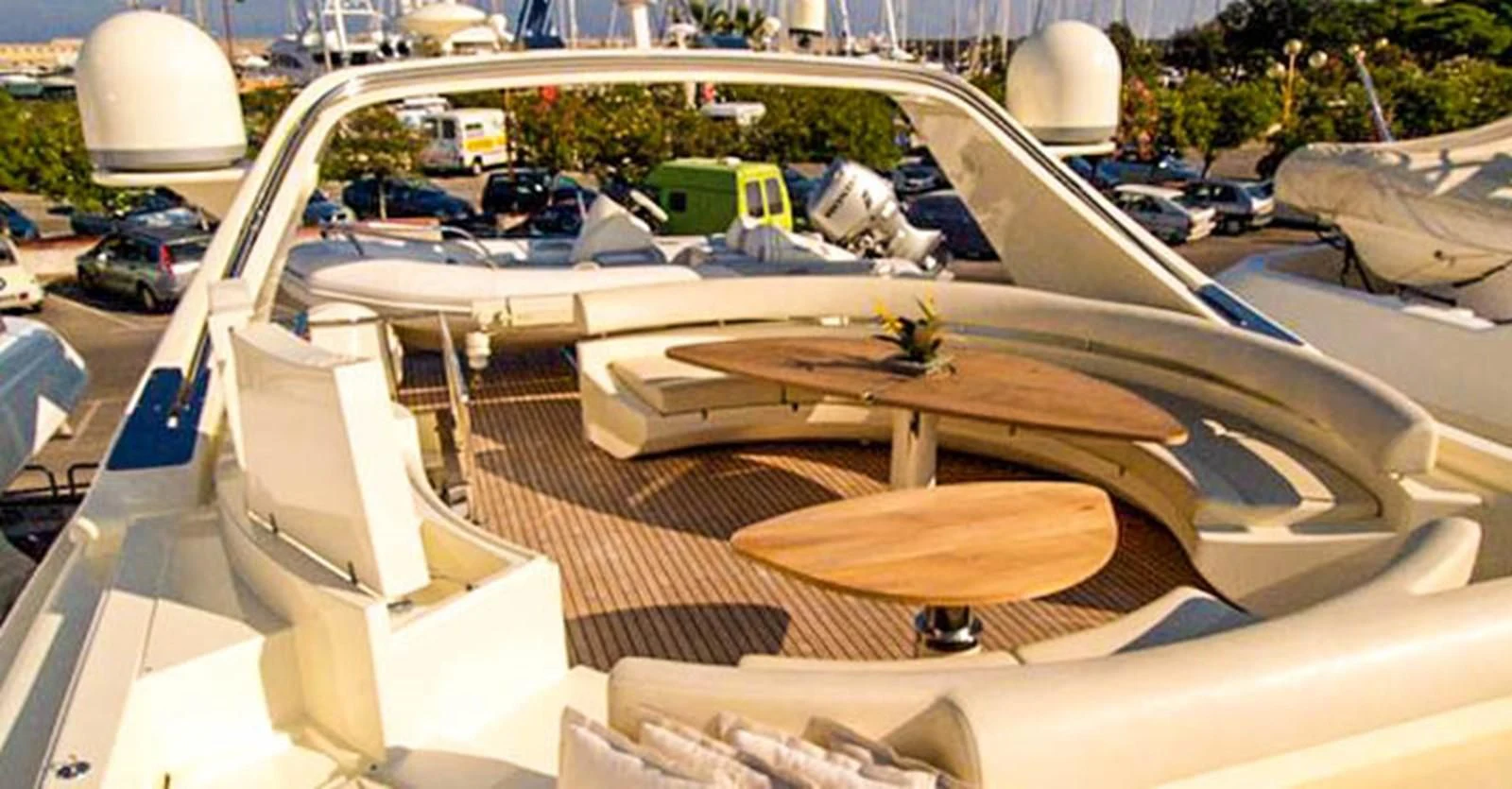 a large white boat with a wooden deck and a white boat on it aboard ADEL I Yacht for Sale