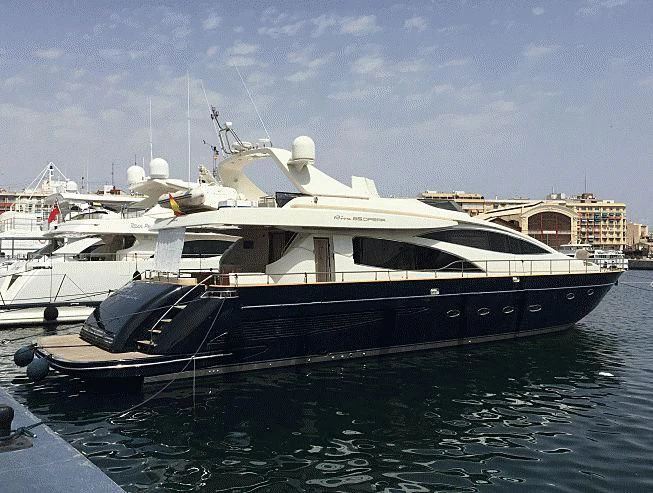 a boat docked at a pier aboard ADEL I Yacht for Sale