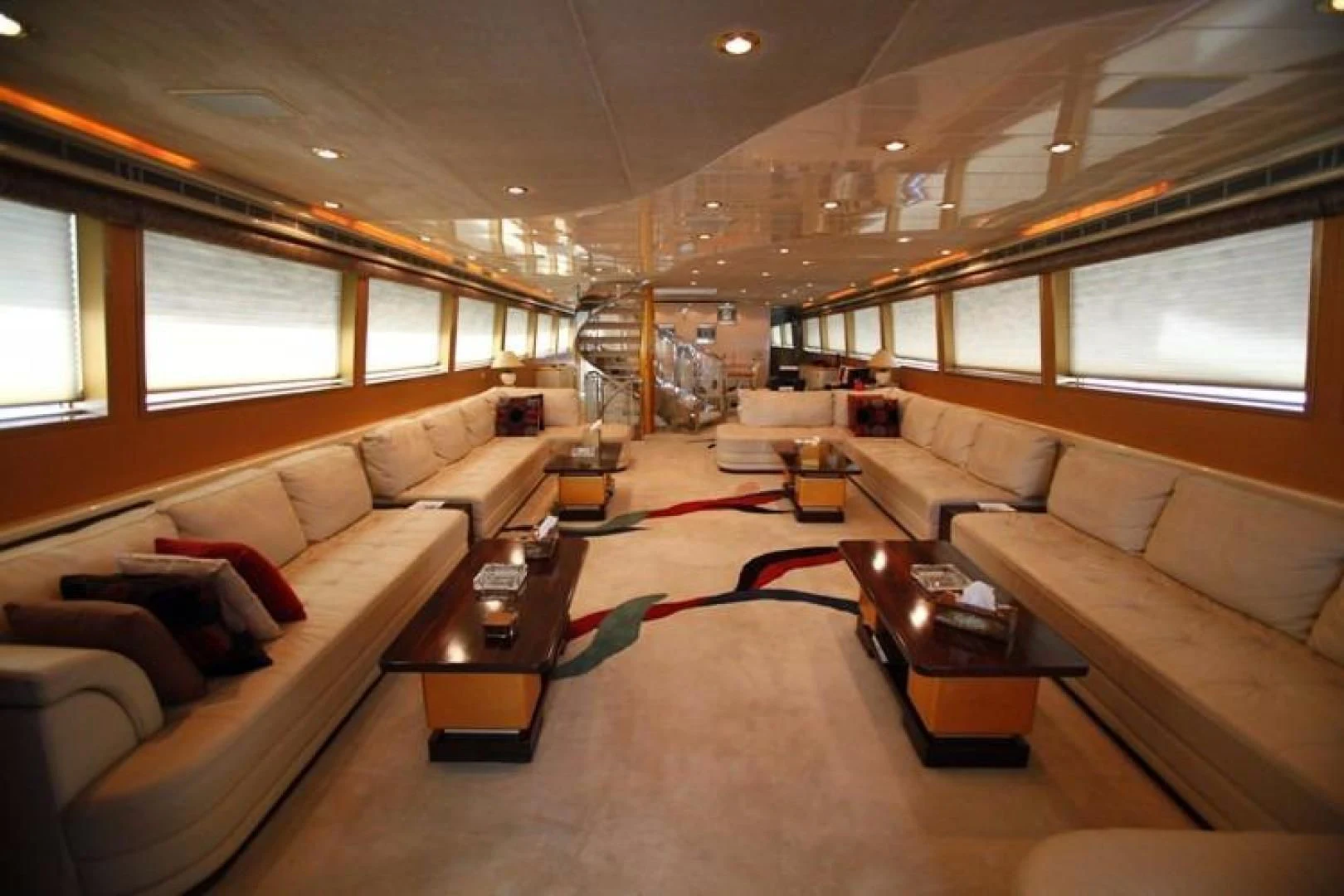 a living room with a red rug aboard TAMTEEN Yacht for Sale