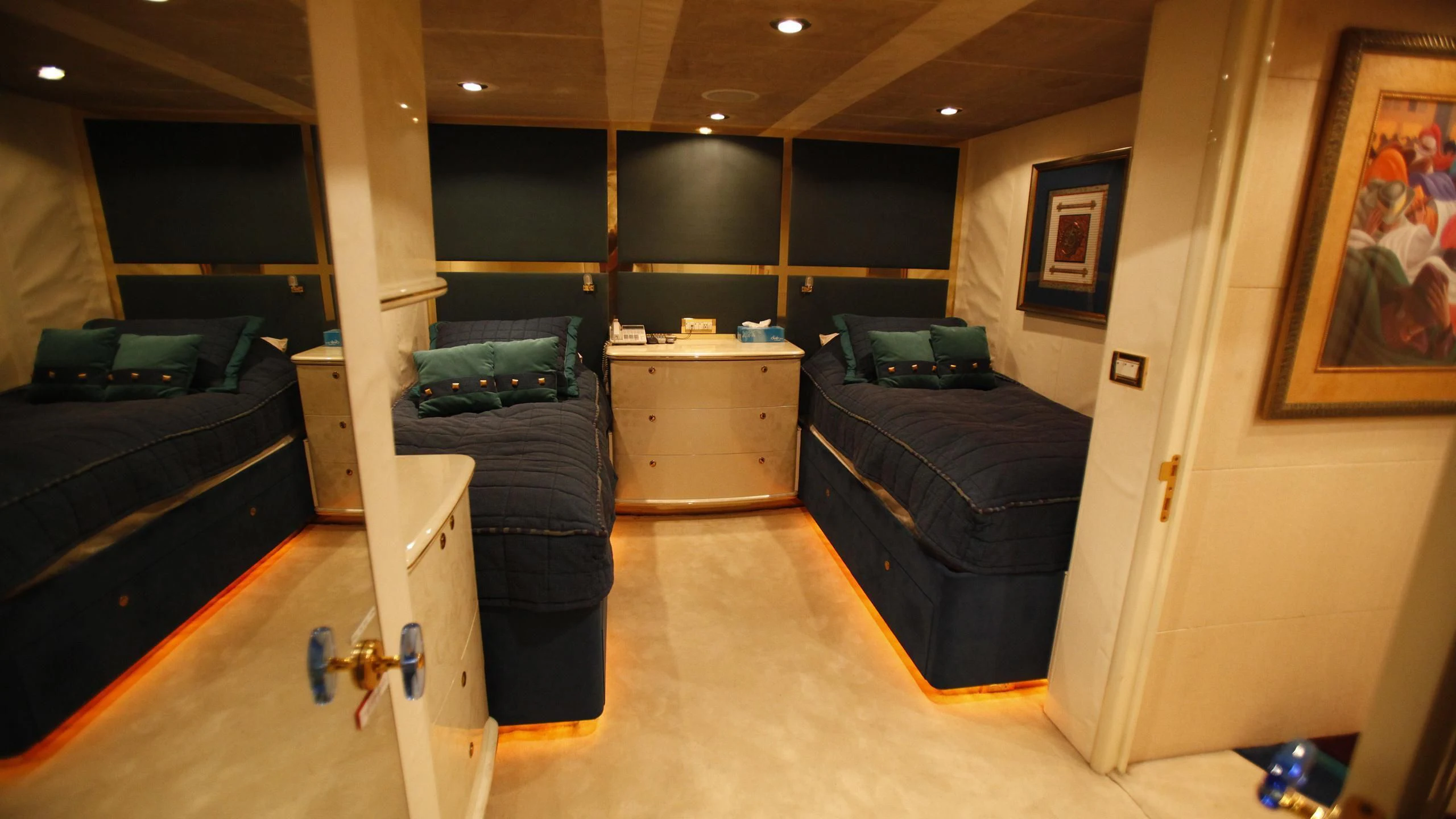 a room with a couch and a bed aboard TAMTEEN Yacht for Sale