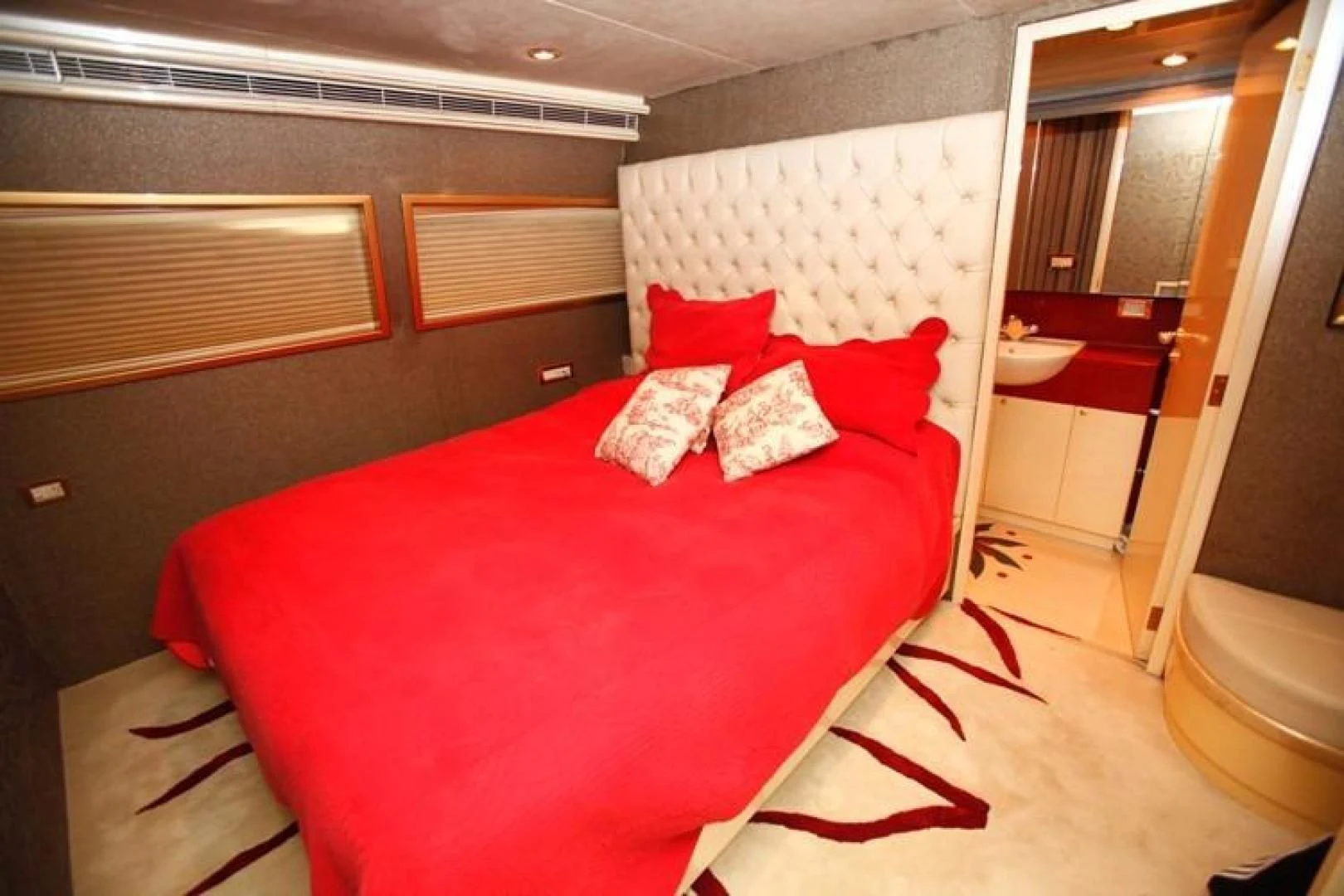 a bed in a room aboard TAMTEEN Yacht for Sale