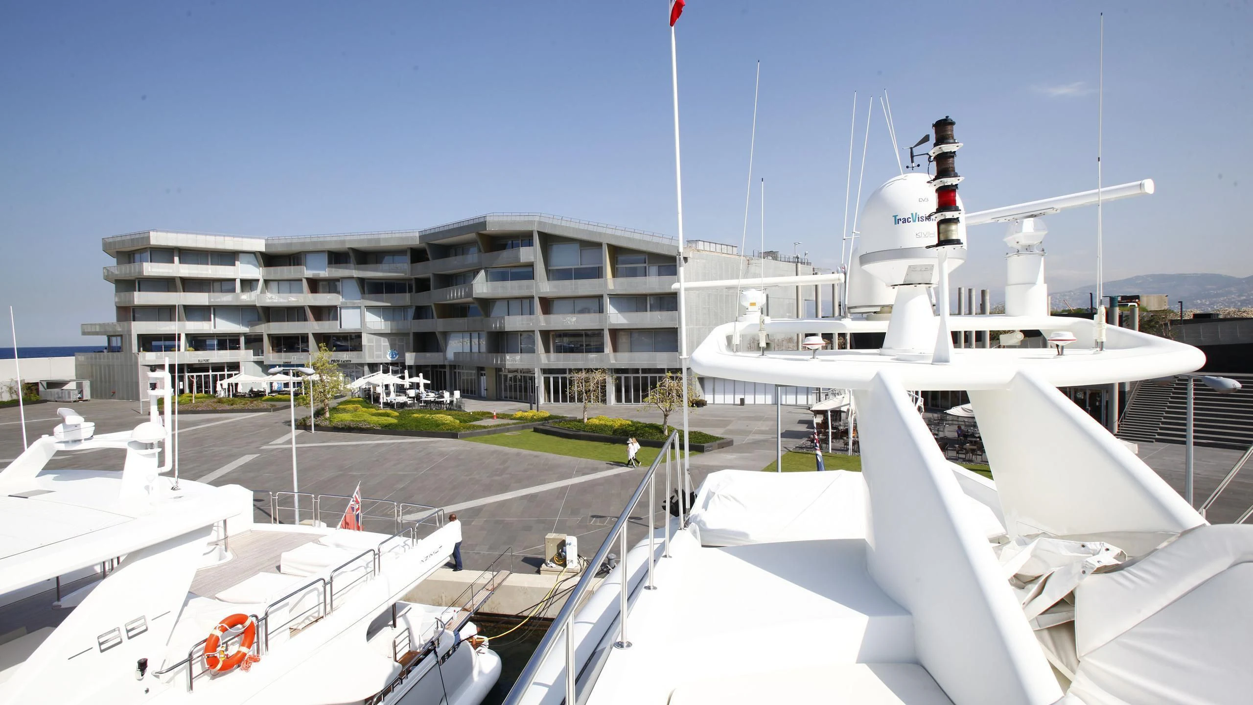 a group of white boats on a dock aboard TAMTEEN Yacht for Sale