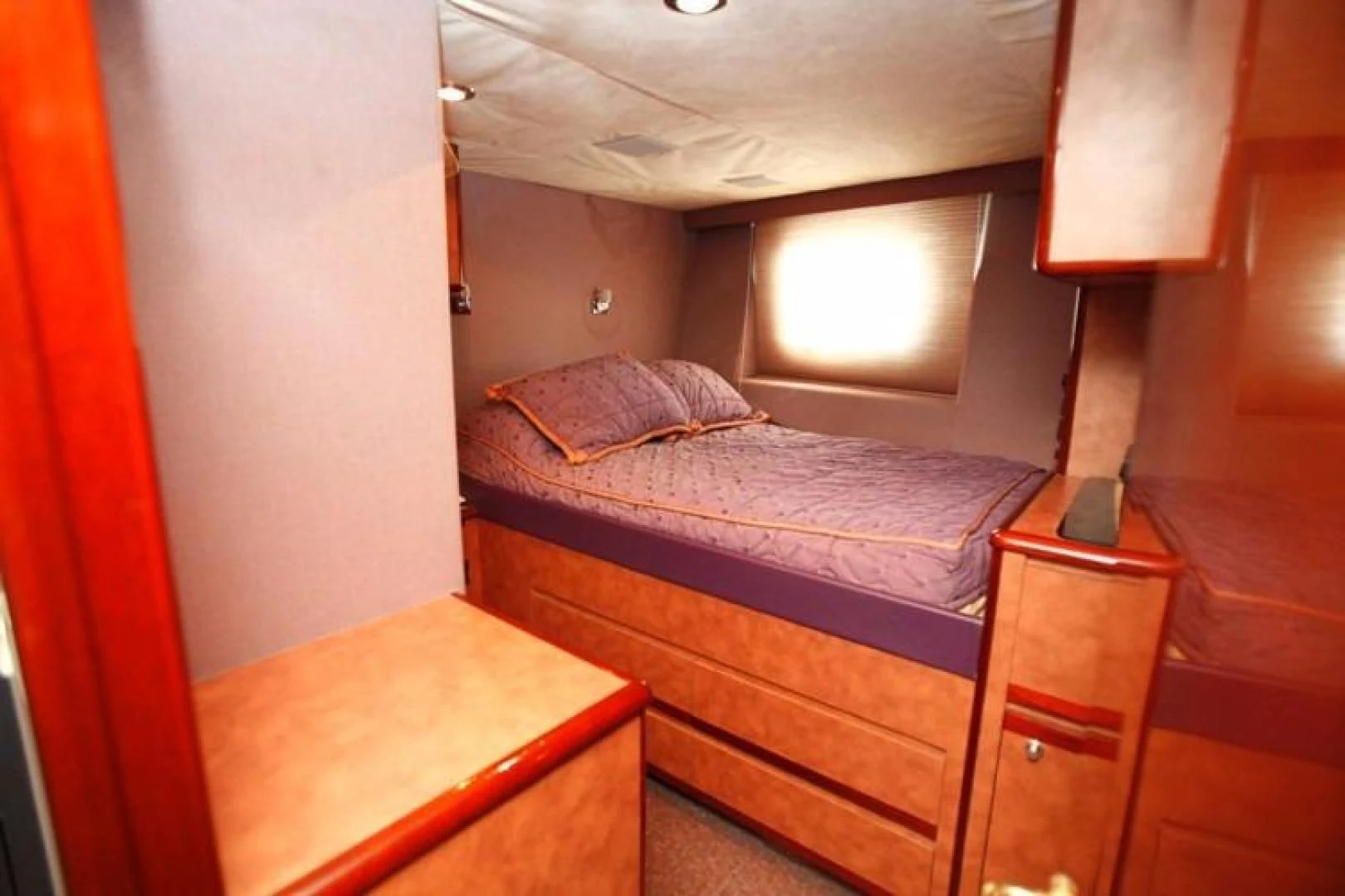 a room with a bed and a lamp aboard TAMTEEN Yacht for Sale