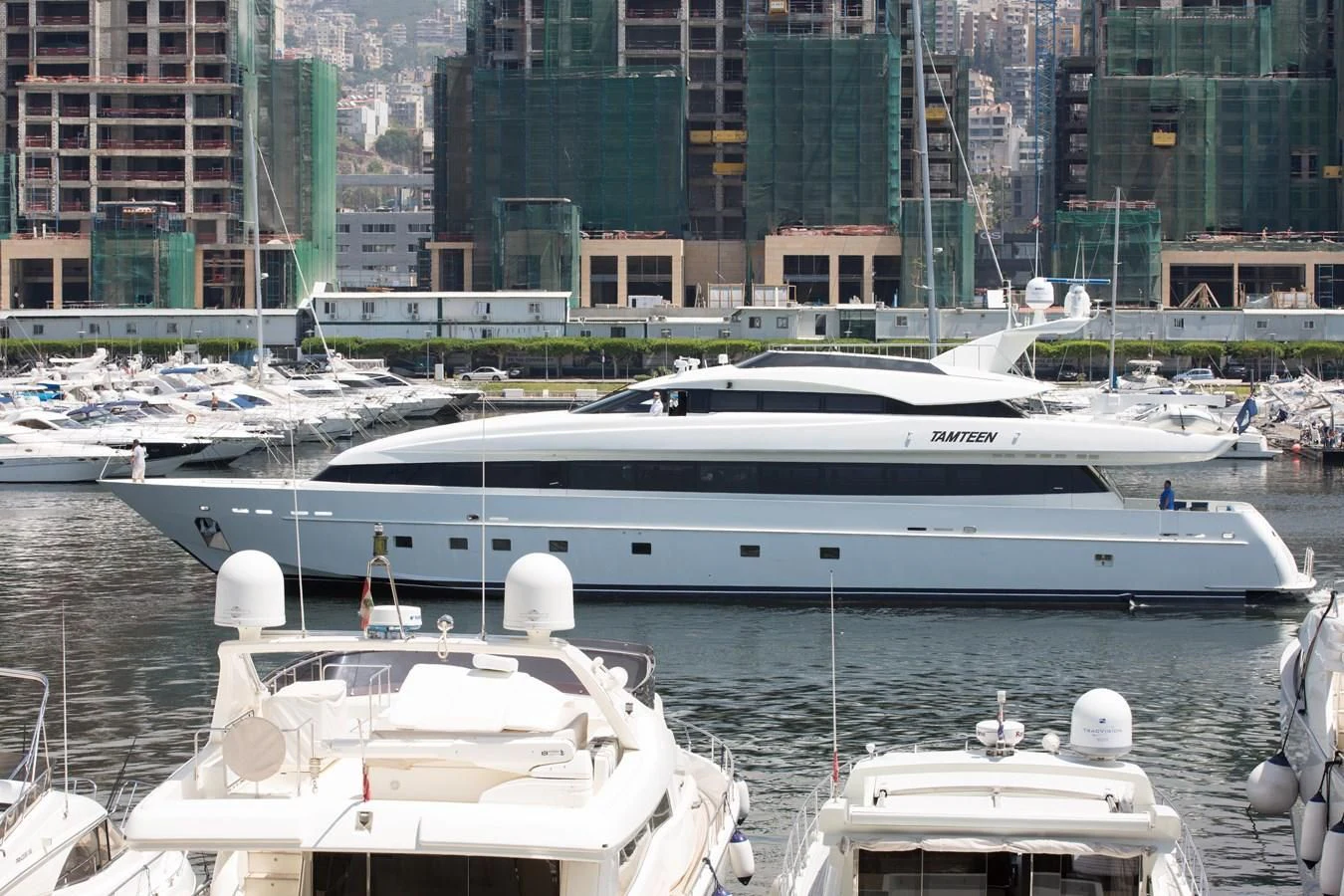 a yacht in a harbor aboard TAMTEEN Yacht for Sale