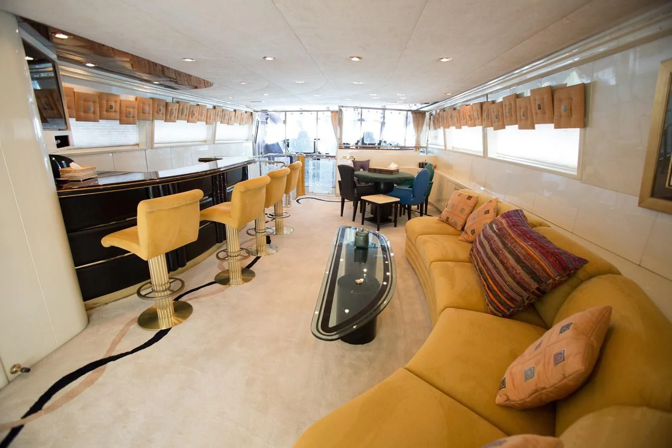 a living room with a table and chairs aboard TAMTEEN Yacht for Sale