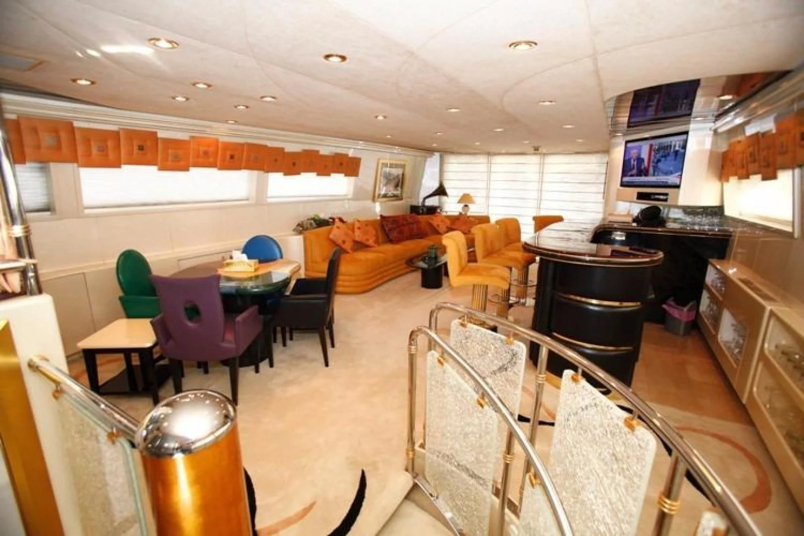 a large room with tables and chairs aboard TAMTEEN Yacht for Sale