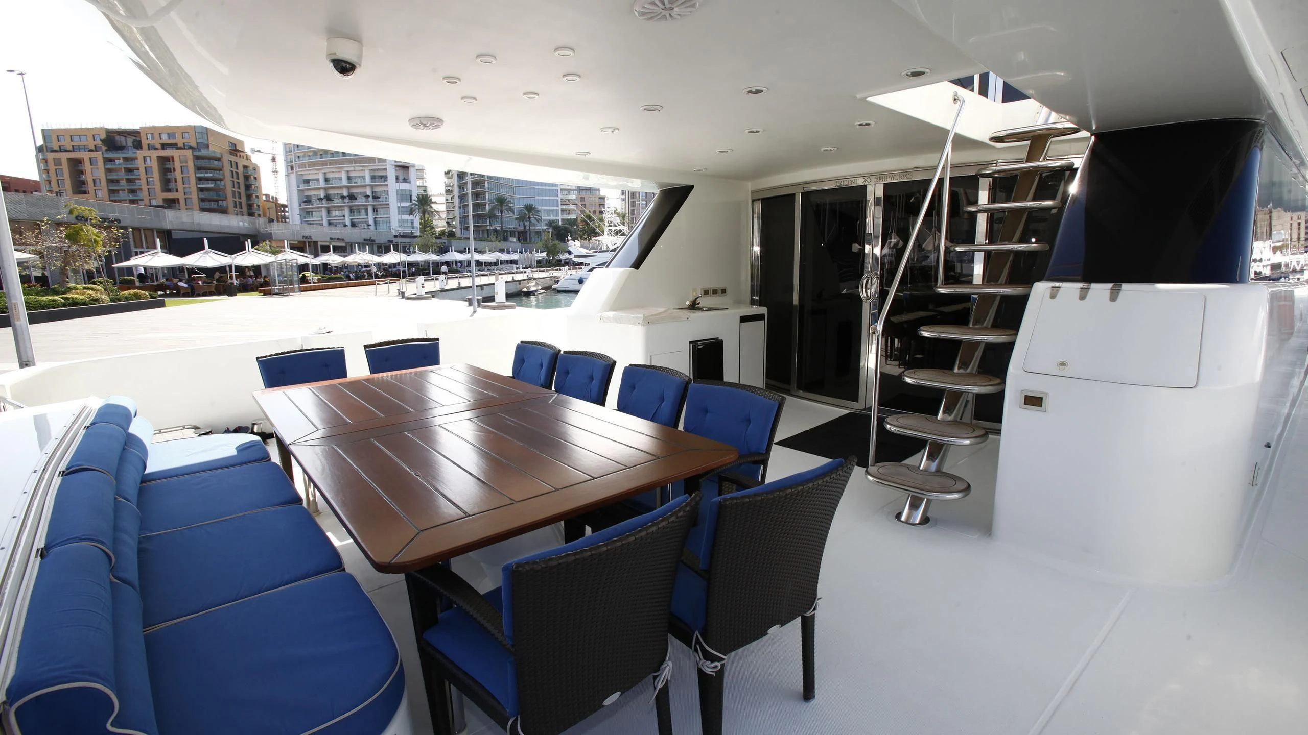 a room with a table chairs and a ladder aboard TAMTEEN Yacht for Sale