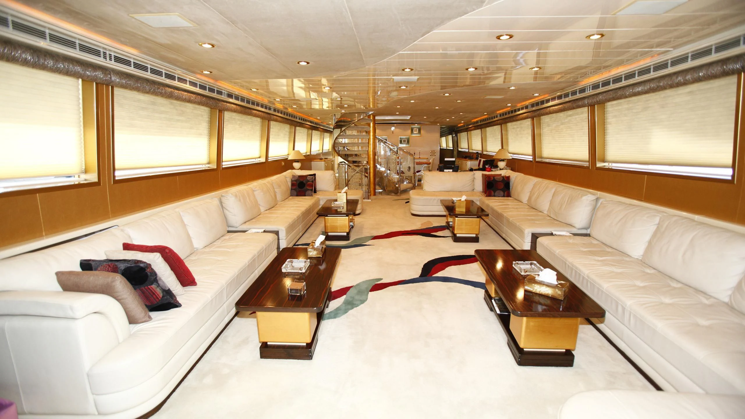 a living room with a red rug aboard TAMTEEN Yacht for Sale