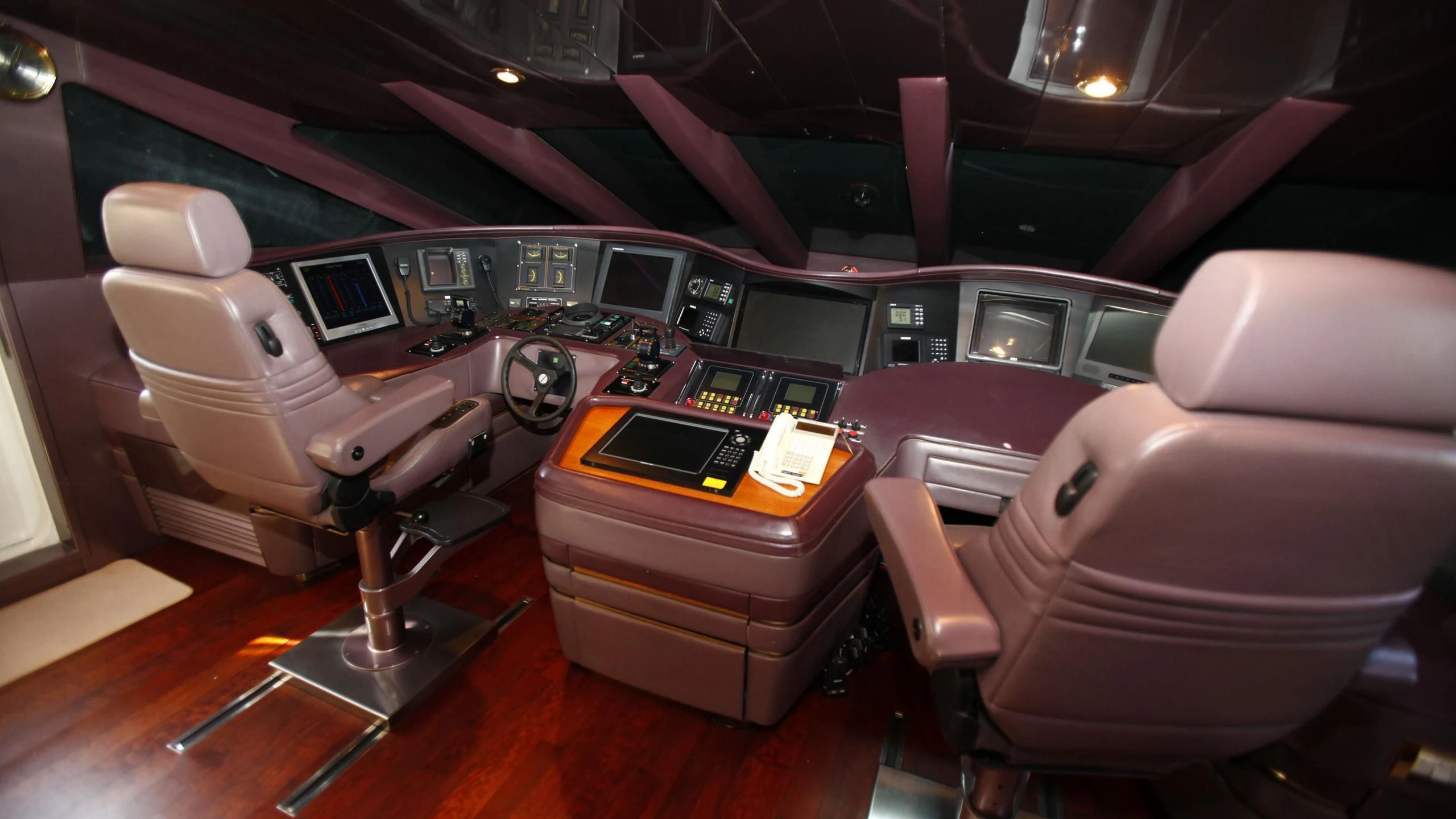 a car with a desk and a chair in the back aboard TAMTEEN Yacht for Sale