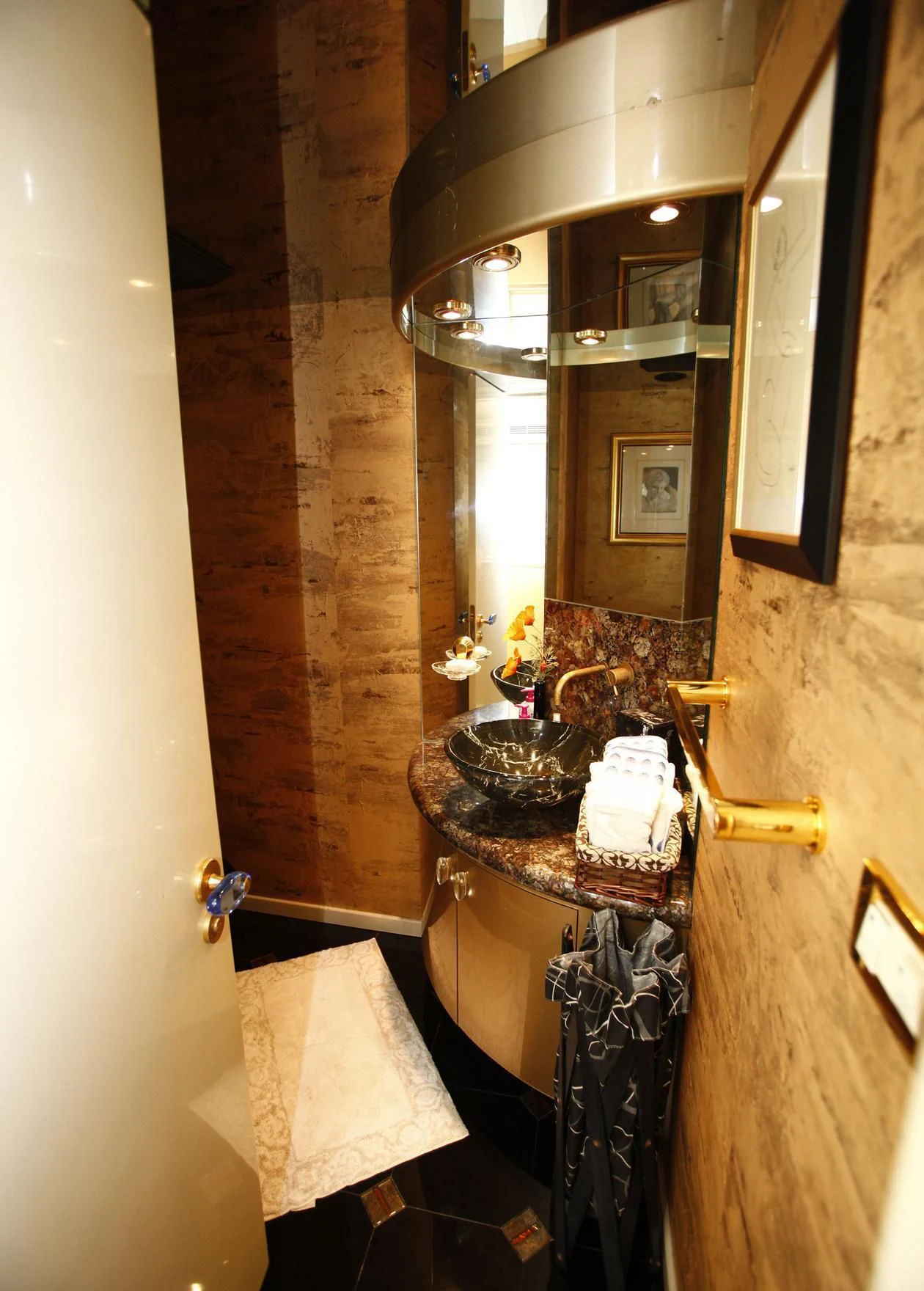 a bathroom with a sink and a mirror aboard TAMTEEN Yacht for Sale