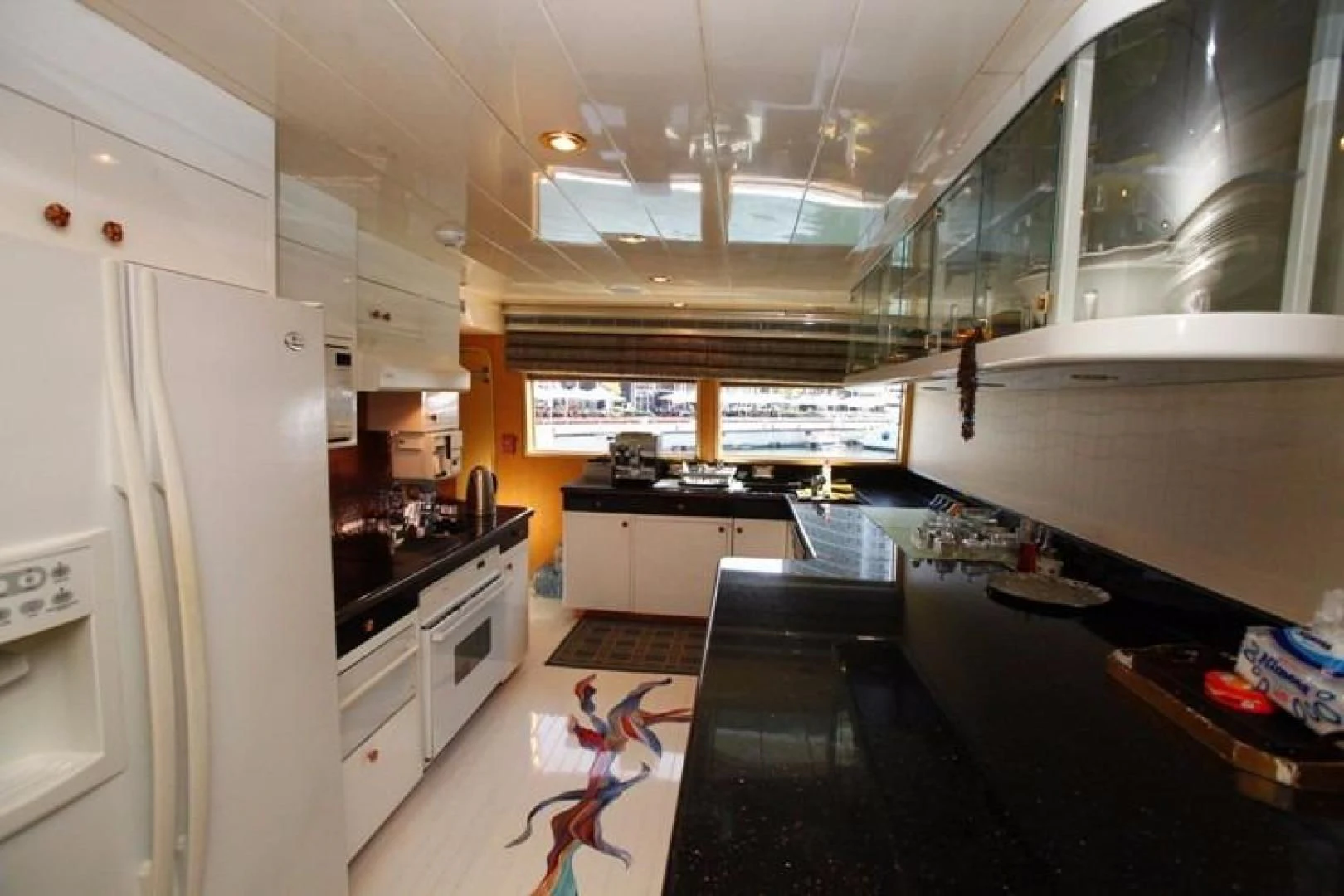 a kitchen with a large island aboard TAMTEEN Yacht for Sale
