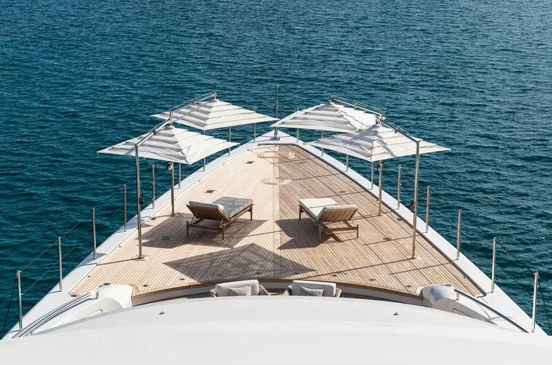 a white boat on a dock aboard CALEX Yacht for Sale