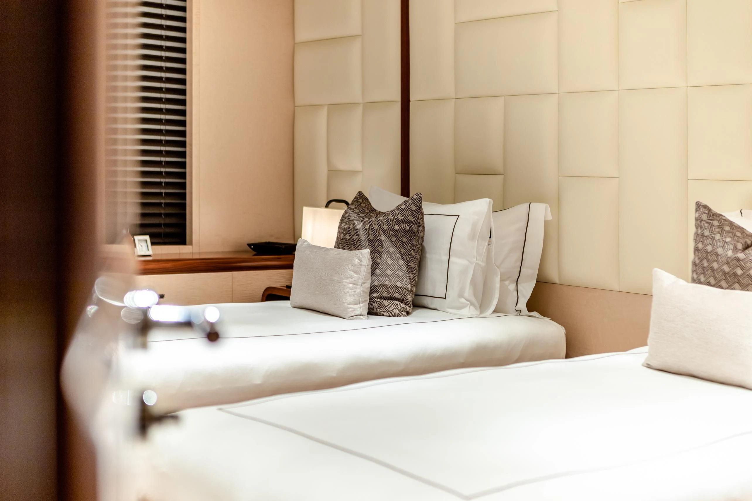 a bed with pillows and pillows aboard CALEX Yacht for Sale