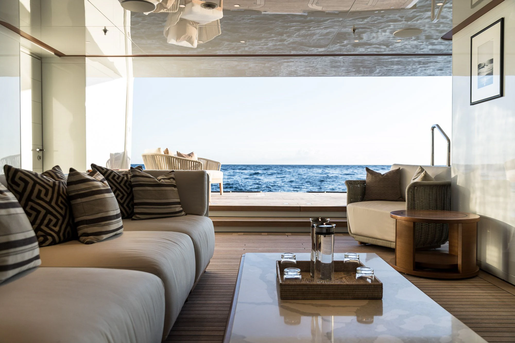 a living room with a large window aboard CALEX Yacht for Sale