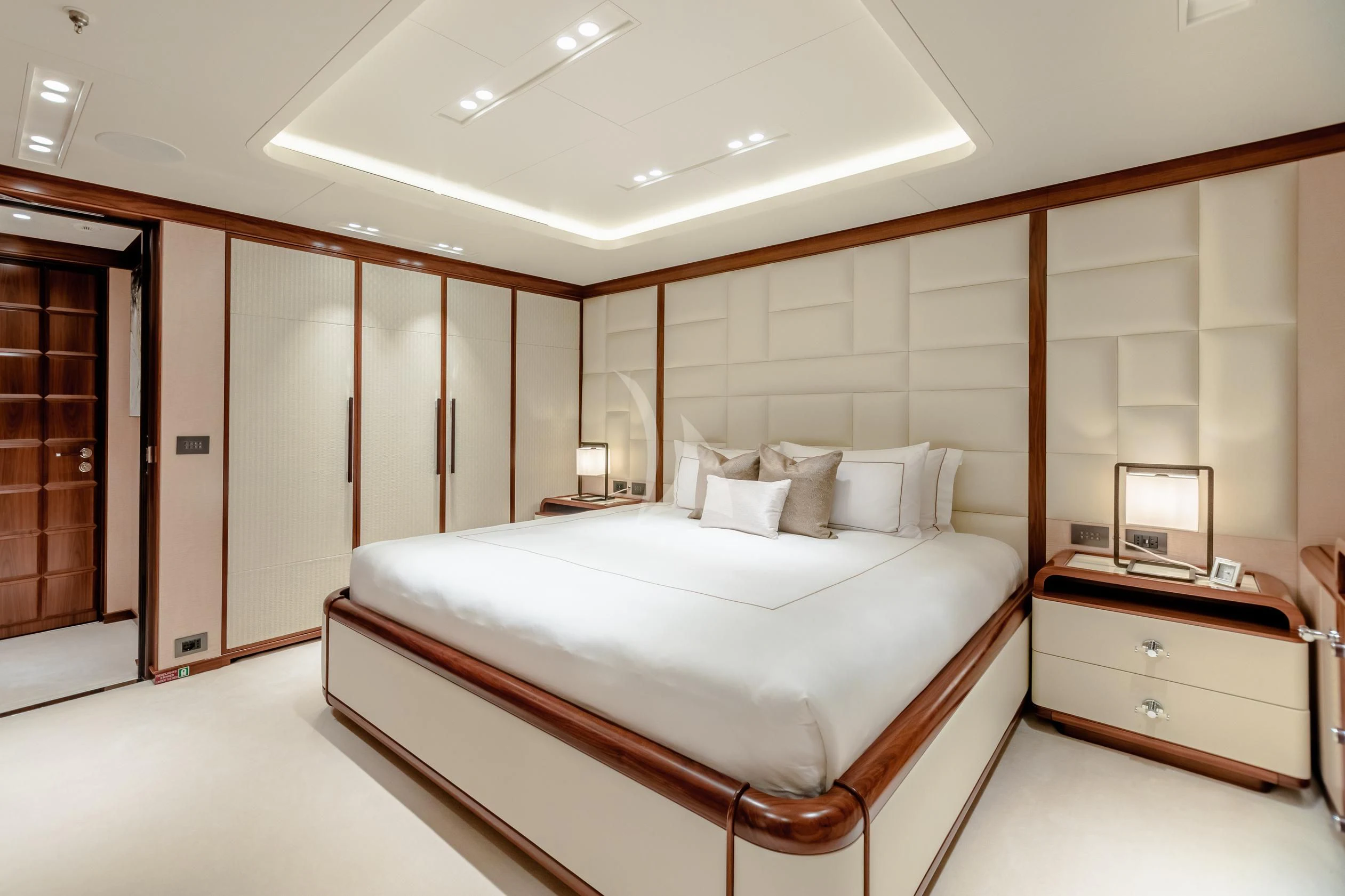a large bedroom with a bed aboard CALEX Yacht for Sale