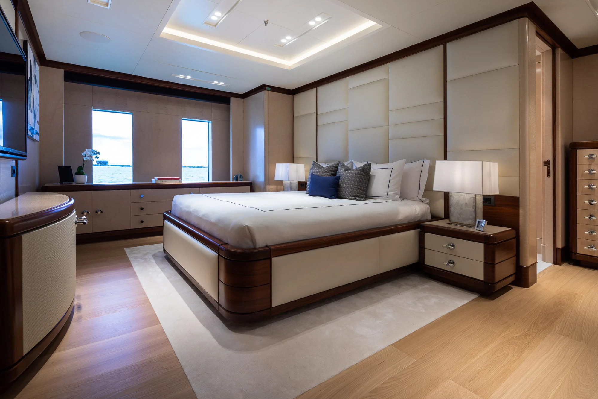 a large bedroom with a bed aboard CALEX Yacht for Sale