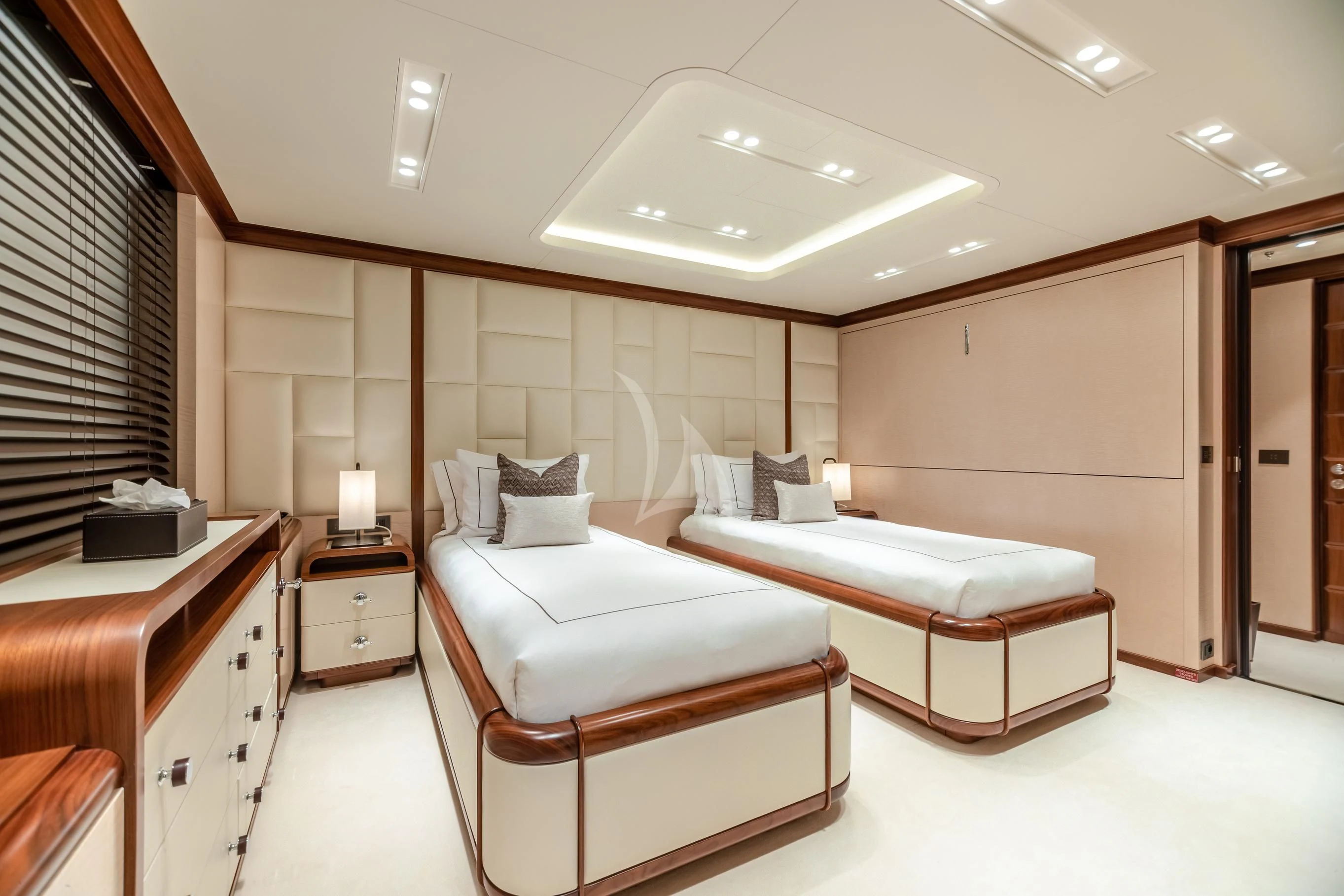 a room with a bed and a desk aboard CALEX Yacht for Sale