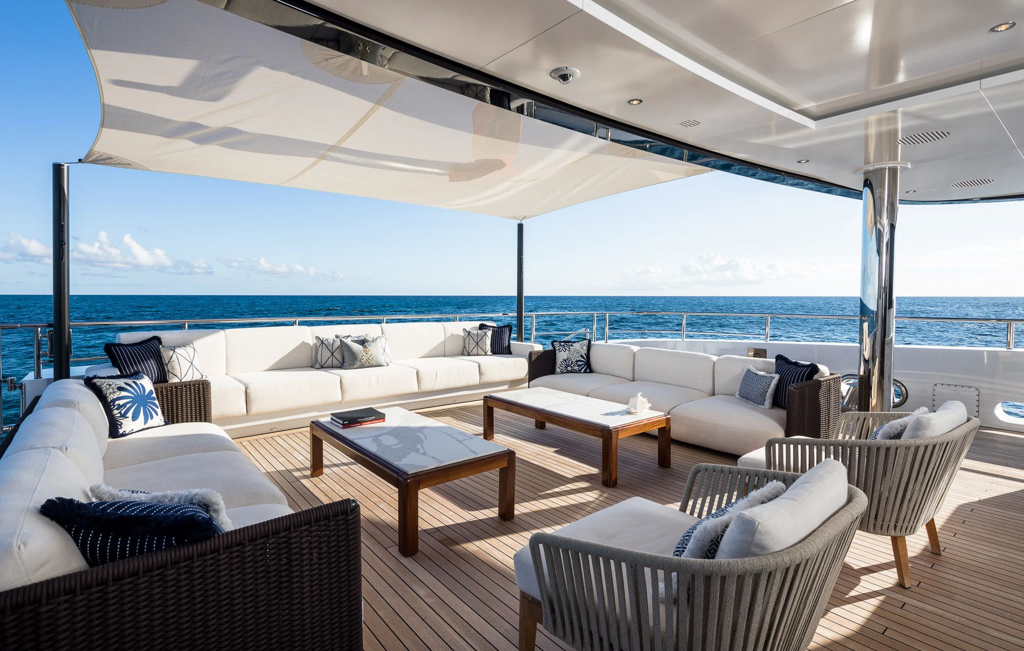 a living room with a large ocean aboard CALEX Yacht for Sale