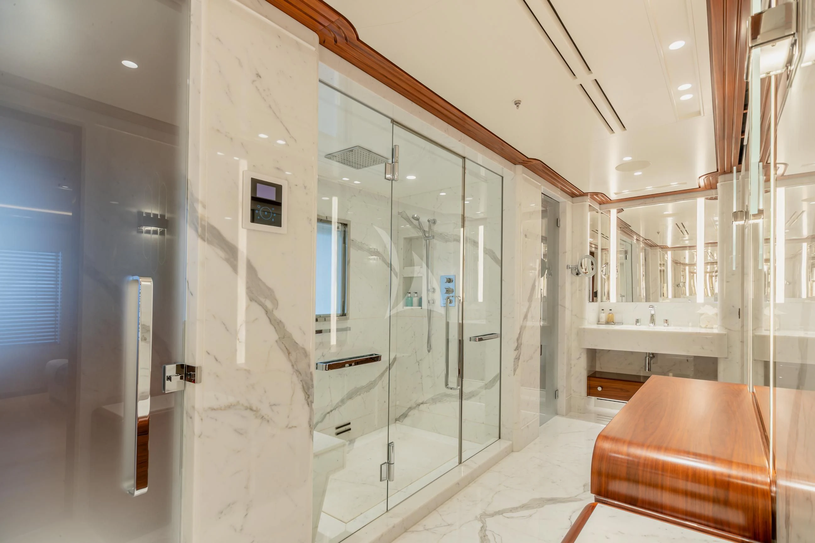 a large bathroom with glass doors aboard CALEX Yacht for Sale