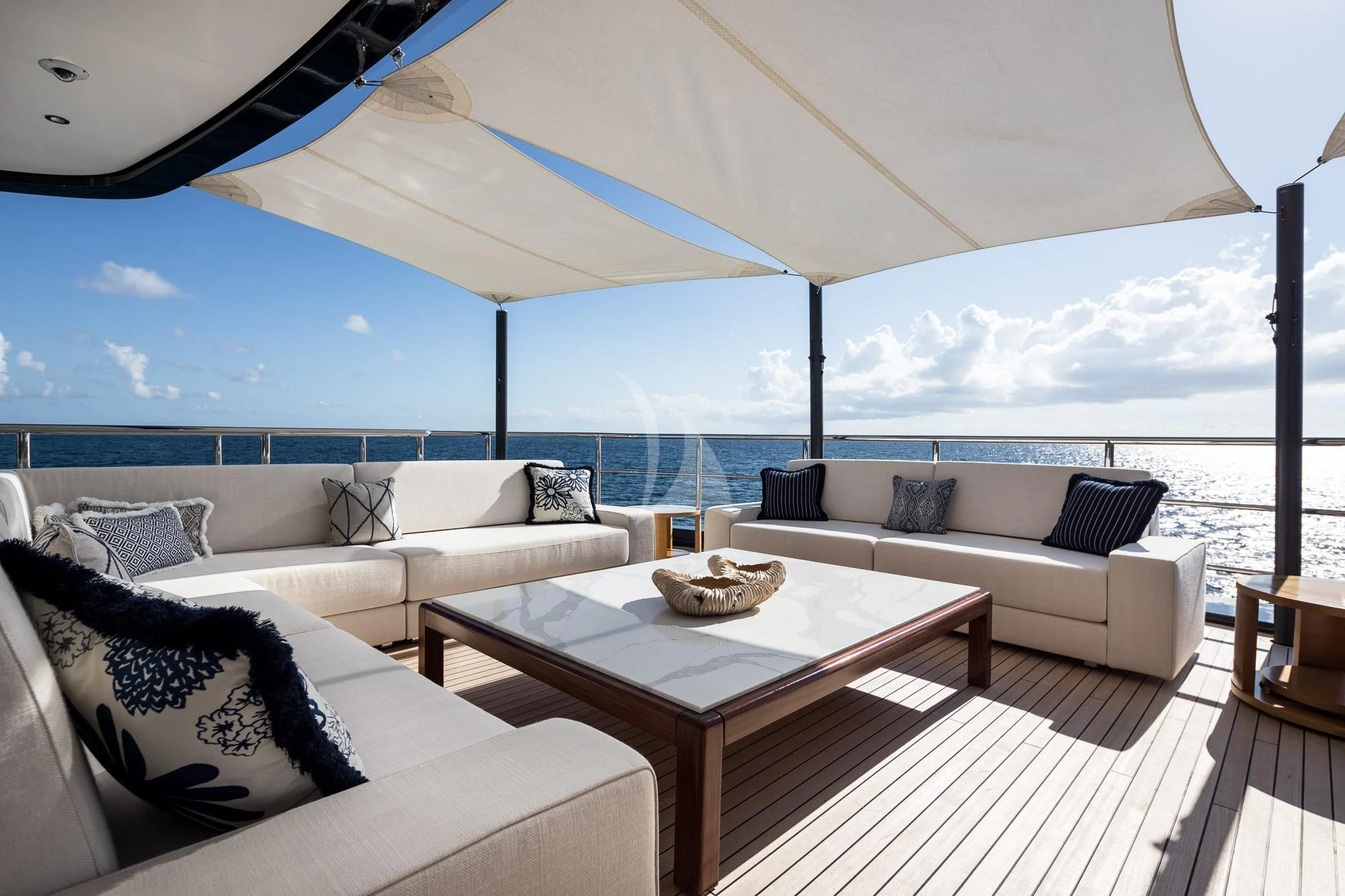 a living room with a large patio aboard CALEX Yacht for Sale