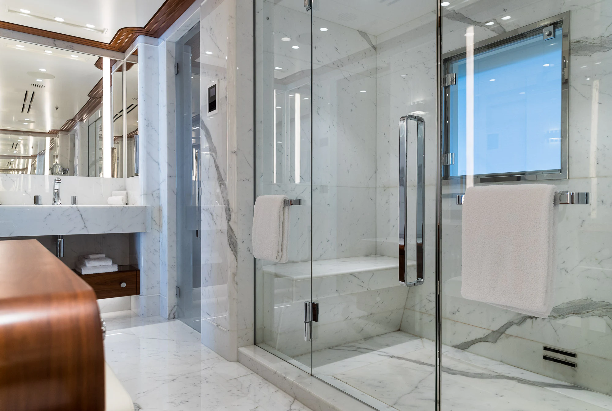 a bathroom with glass walls aboard CALEX Yacht for Sale