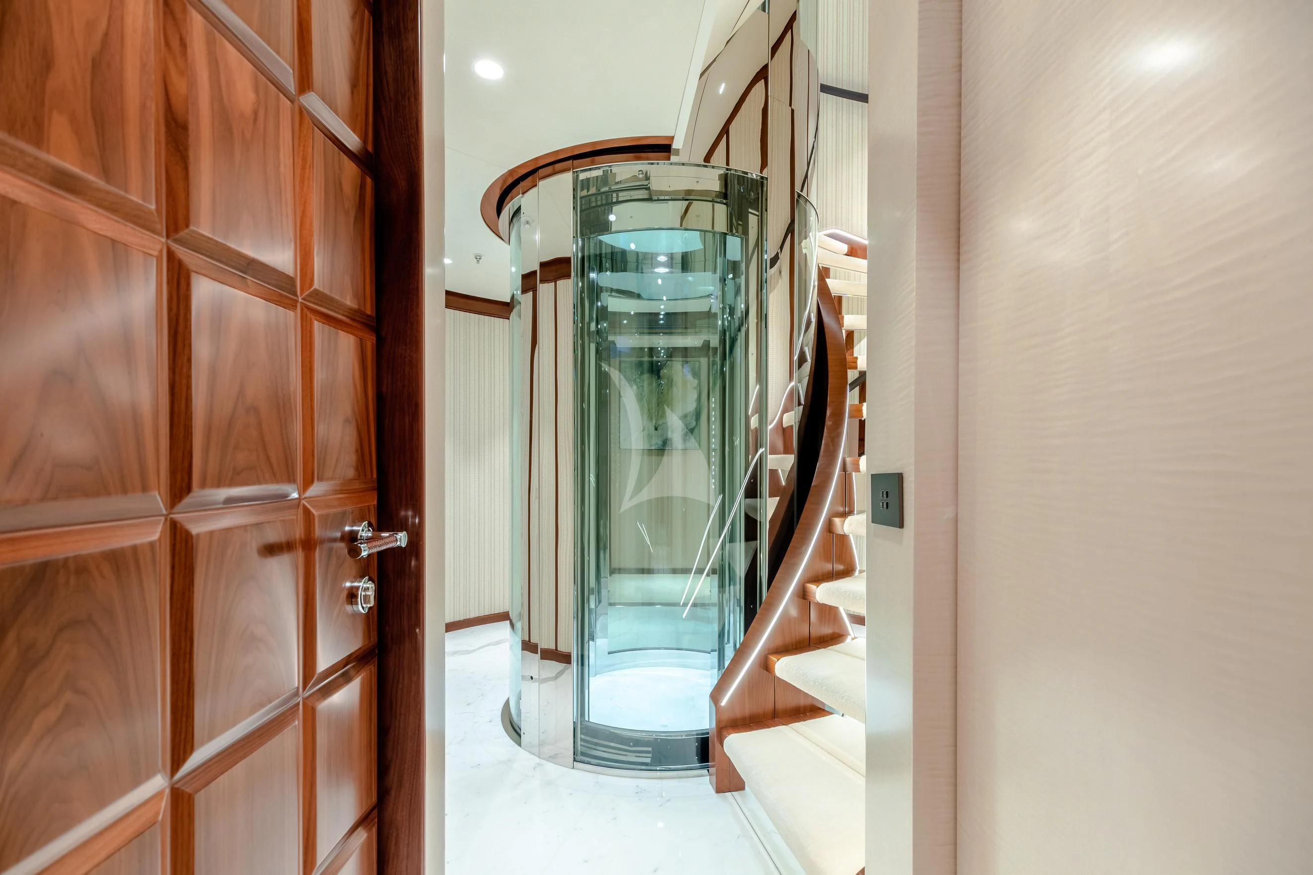 a glass door leading to a room aboard CALEX Yacht for Sale