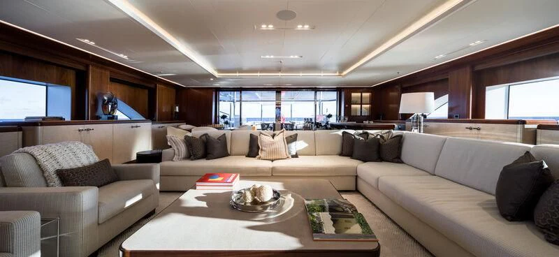a living room with a large window aboard CALEX Yacht for Sale
