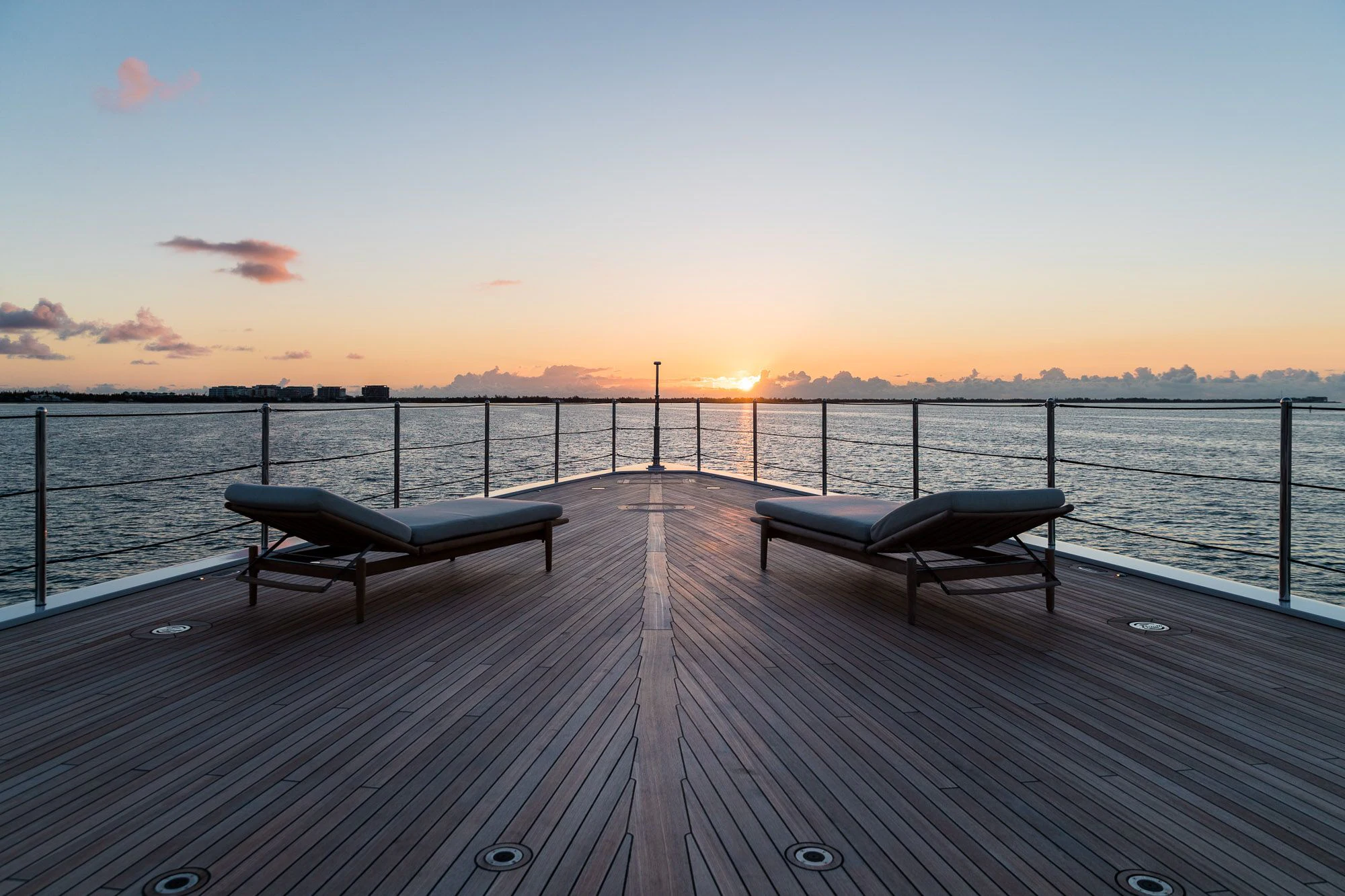 a dock with benches on it aboard CALEX Yacht for Sale