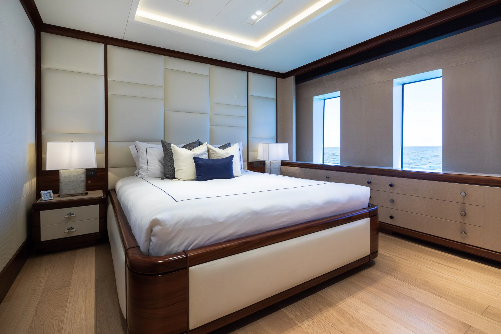 a bedroom with a large bed aboard CALEX Yacht for Sale