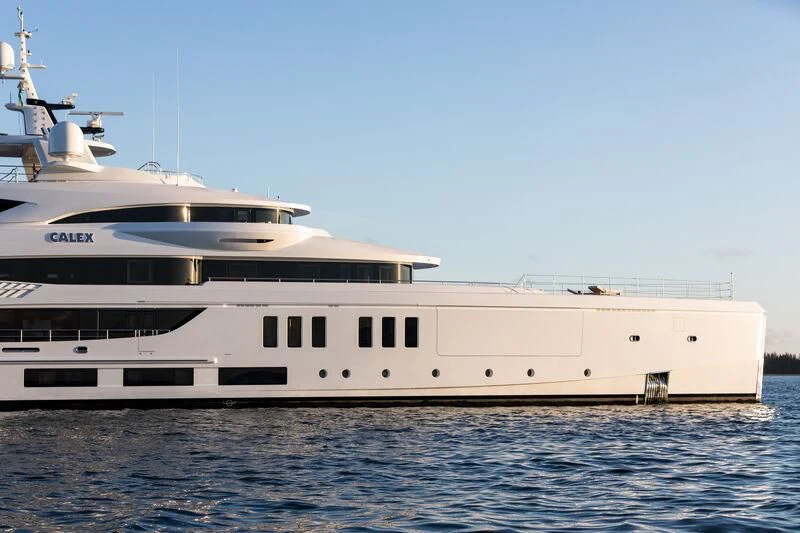 a large white yacht in the water aboard CALEX Yacht for Sale